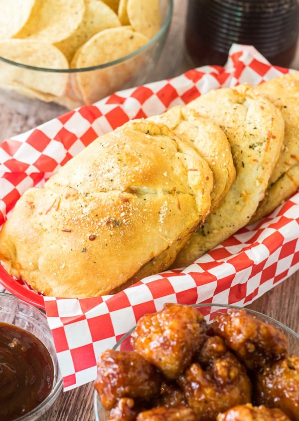 BBQ Chicken Pizza Pockets in basket with checkered paper