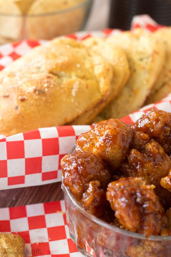 Bowl of BBQ chicken with BBQ Chicken Pizza Pockets in background