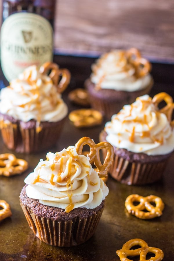 Chocolate Stout Pub Cupcakes on baking sheet garnished with pretzels