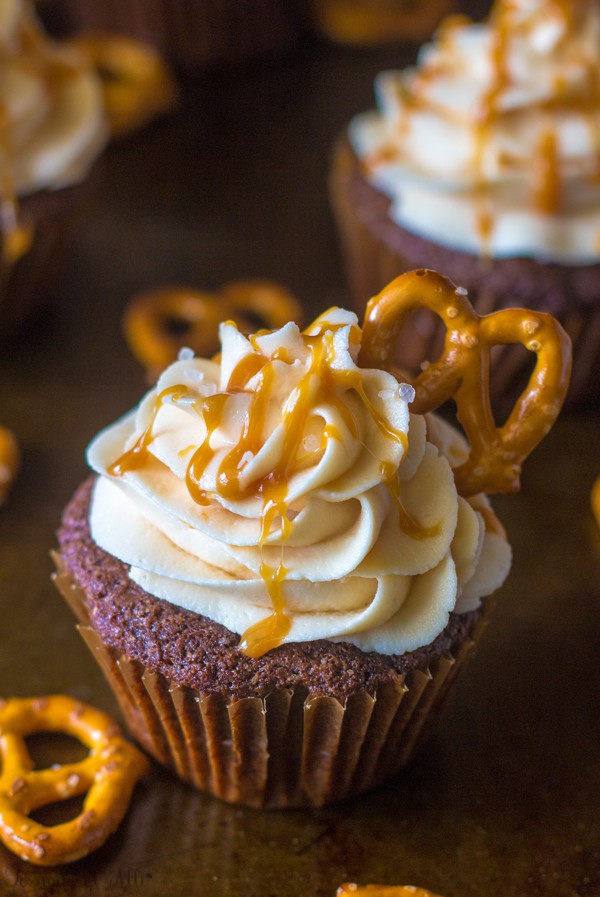 Up close of one Chocolate Stout Pub Cupcakes showing  caramel and pretzel