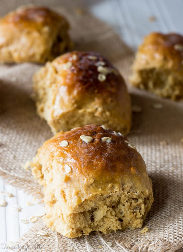 Oatmeal Molasses Bread made into rolls on burlap