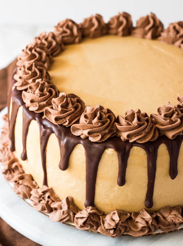 Peanut Butter Banana Cake with Whipped Ganache on turn table