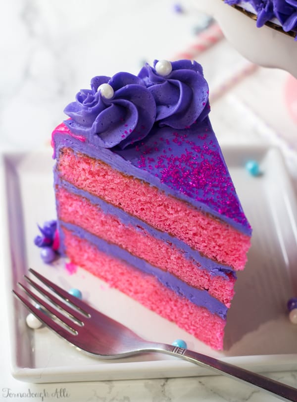 Slice of Pink Velvet Cake on white plate