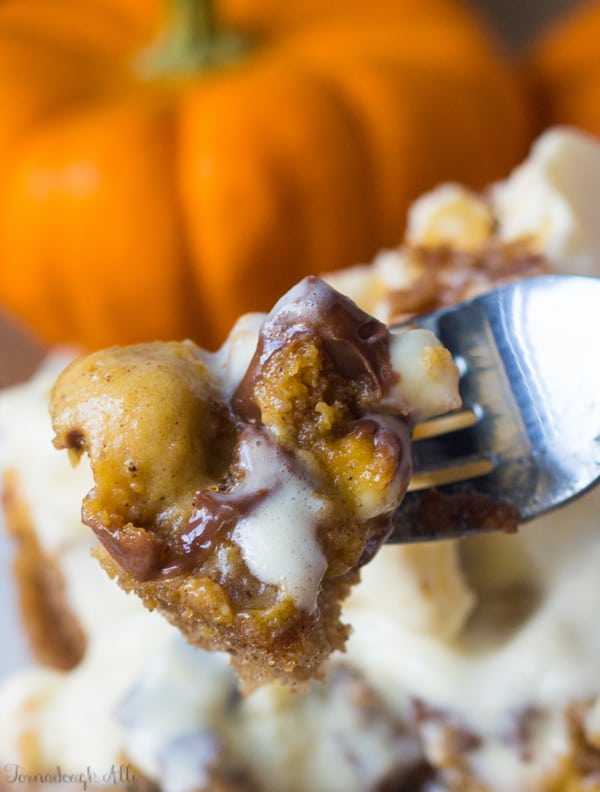 Fork holding piece of Caramel Pumpkin Spice Earthquake Cake