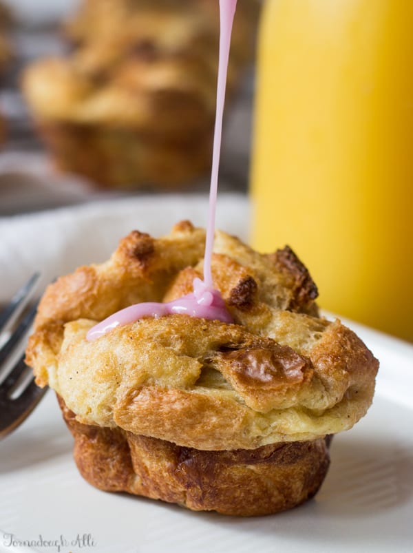 Glaze being drizzled over one Muffin