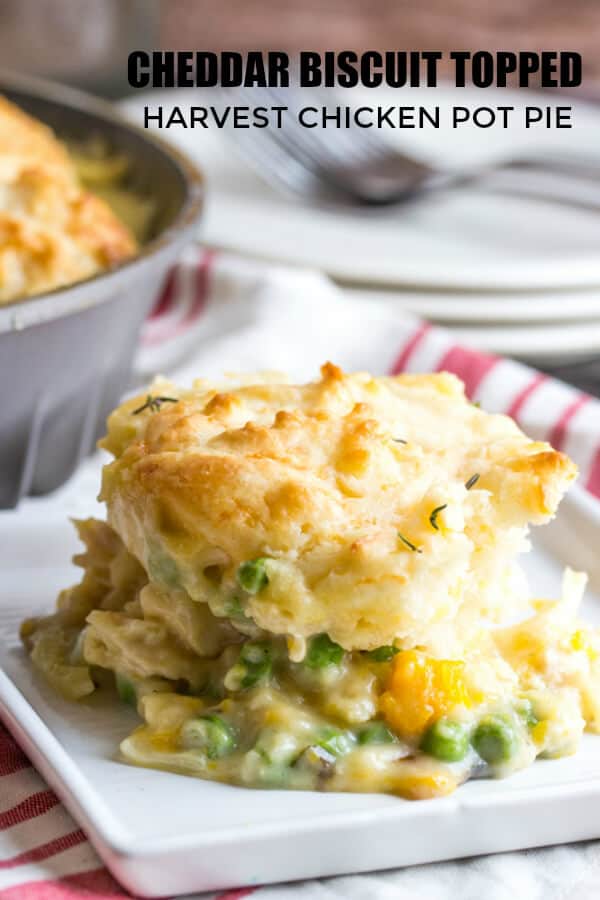 Cheddar Biscuit Topped Harvest Chicken Pot Pie pinterest image with slice on white plate