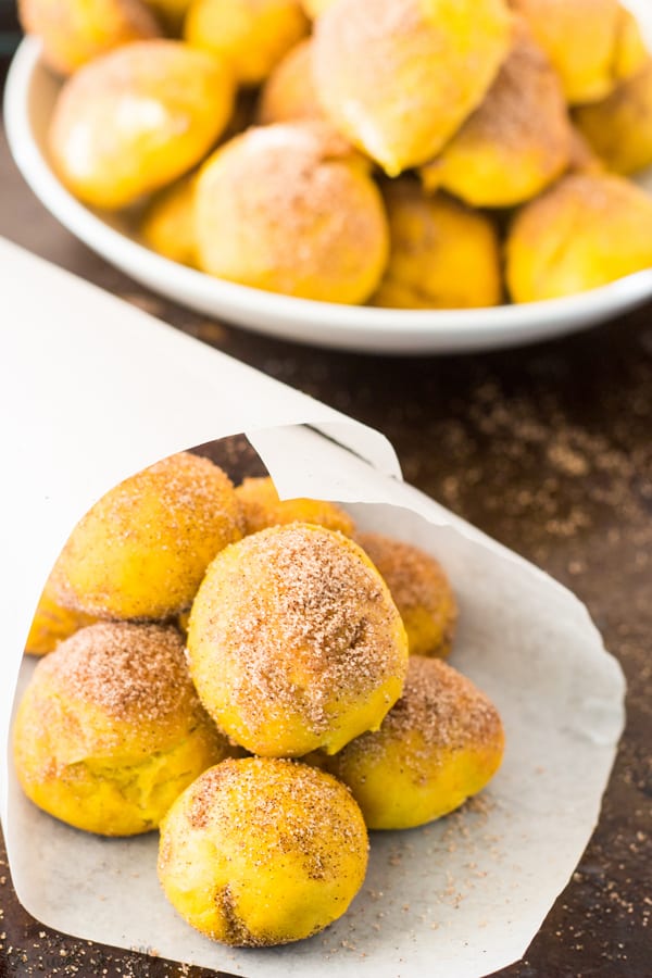 Parchment paper cone filled with Cinnamon Sugar Pumpkin Pretzel Bites