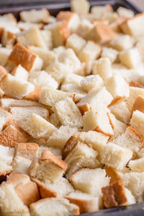 Slice of cut up bread on baking pan