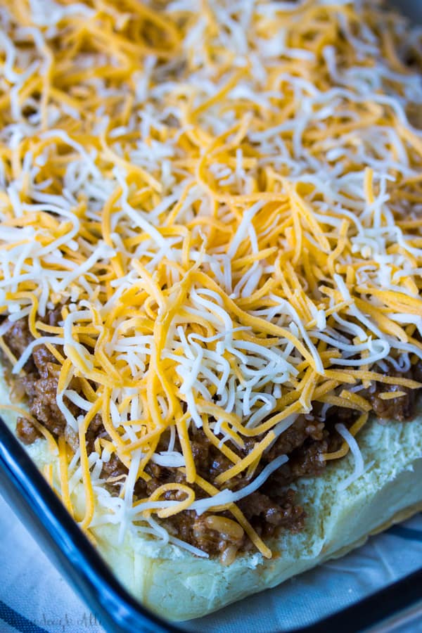 Cheese on top of sloppy Joe mix in pan