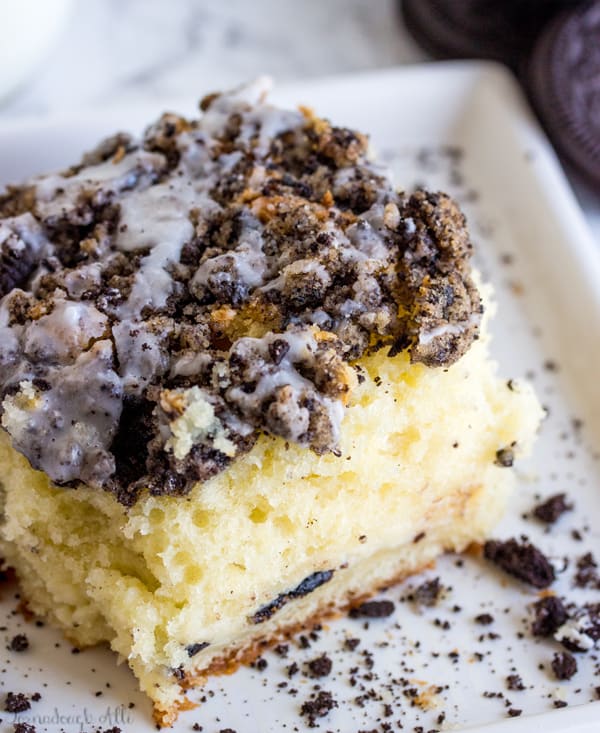 Overhead of a slice of Cookies and Cream Coffee Cake on white plate