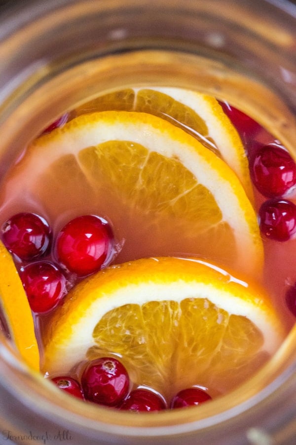 Overhead of Cranberry Orange Mimosas in pitcher