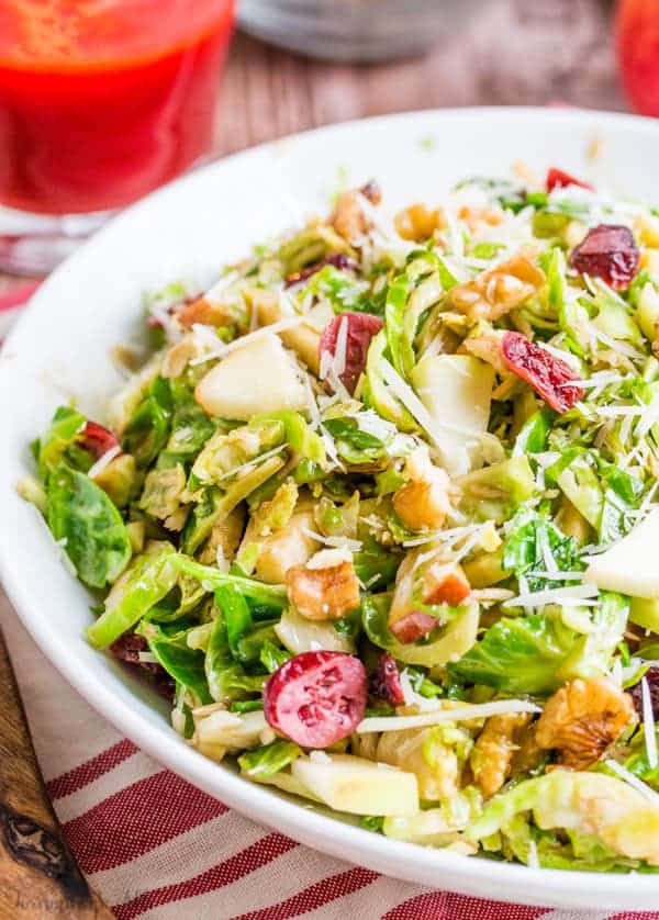 Shredded Brussel Sprout Harvest Salad in white bowl