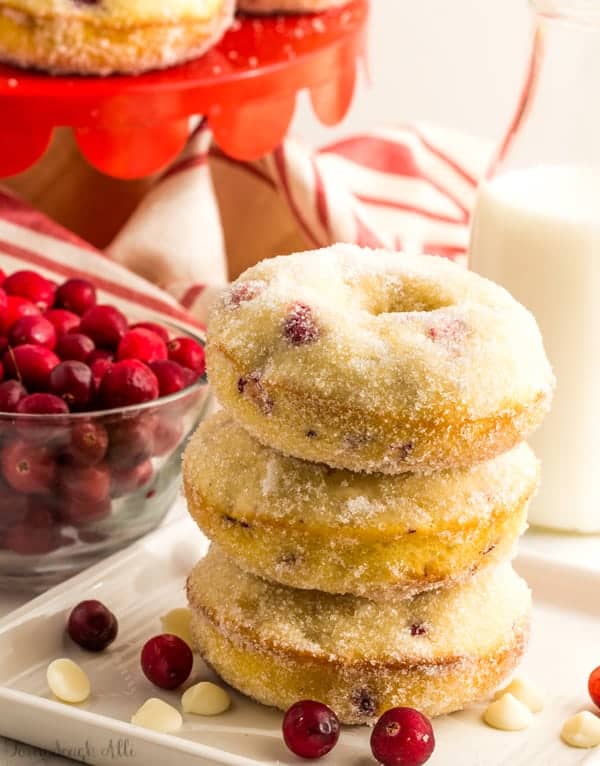 Cranberry Bliss Donuts stacked on white plate