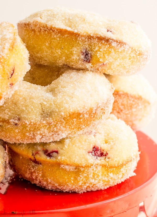 Cranberry Bliss Donuts stacked on red cake stand