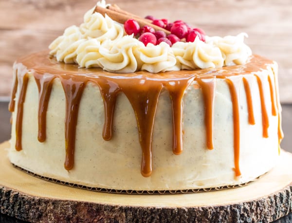 Gingerbread Cake on wooden round with caramel dripping down