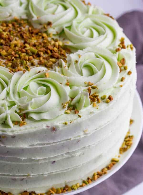 Dark chocolate pistachio layer cake with buttercream frosting.