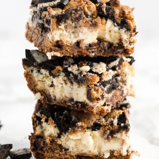 three cheesecake bars stacked on top of one another