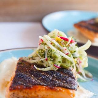 Grilling is a summer staple activity. Cooking this easy grilled salmon dish is simple and delicious, especially with a silky smooth corn puree and a crisp, but light, fennel salad.