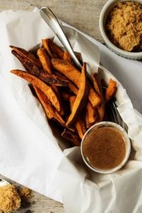 The next time you want a savory and sweet side dish, then try these sweet potato fries with cinnamon, heavy cream, and brown sugar dipping sauce.