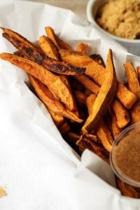 The next time you want a savory and sweet side dish, then try these sweet potato fries with cinnamon, heavy cream, and brown sugar dipping sauce.