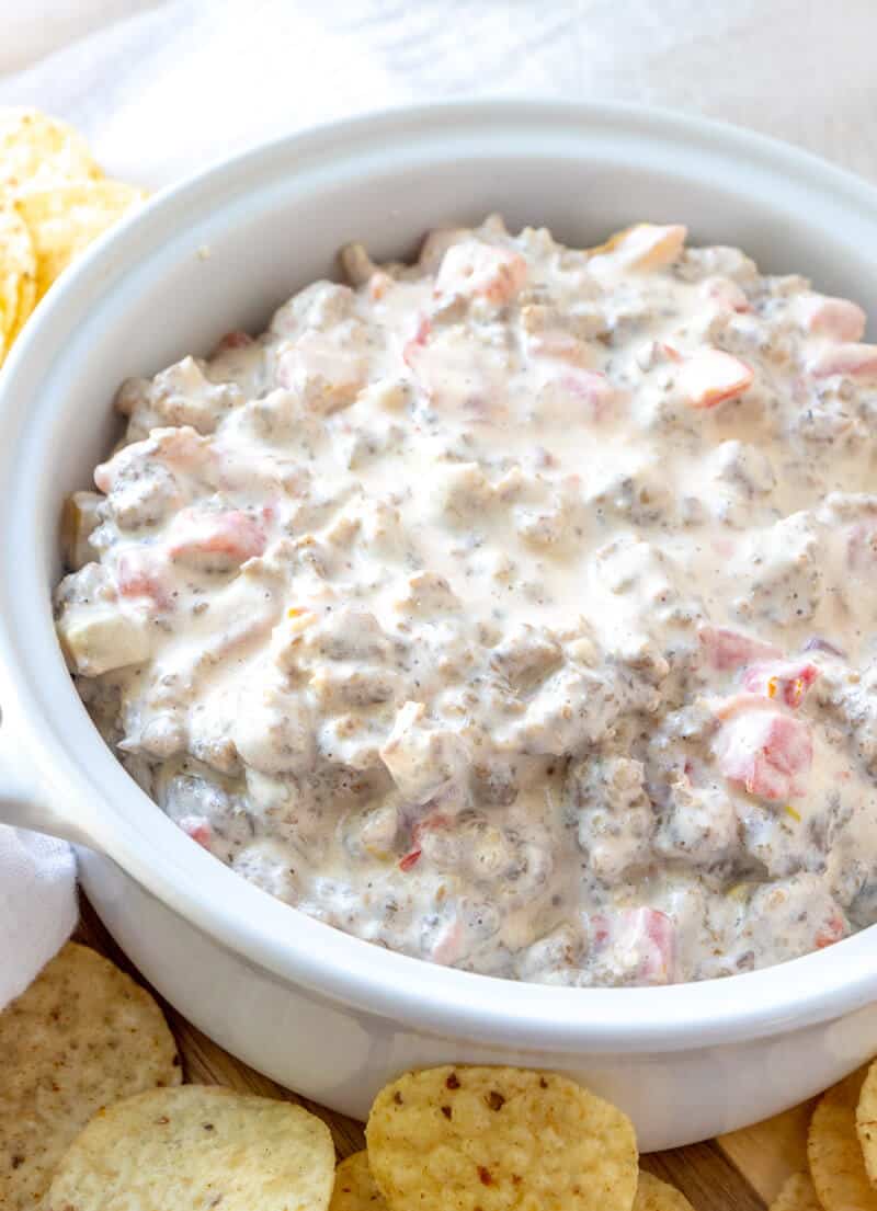 Rotel Sausage Dip in serving dish with chips