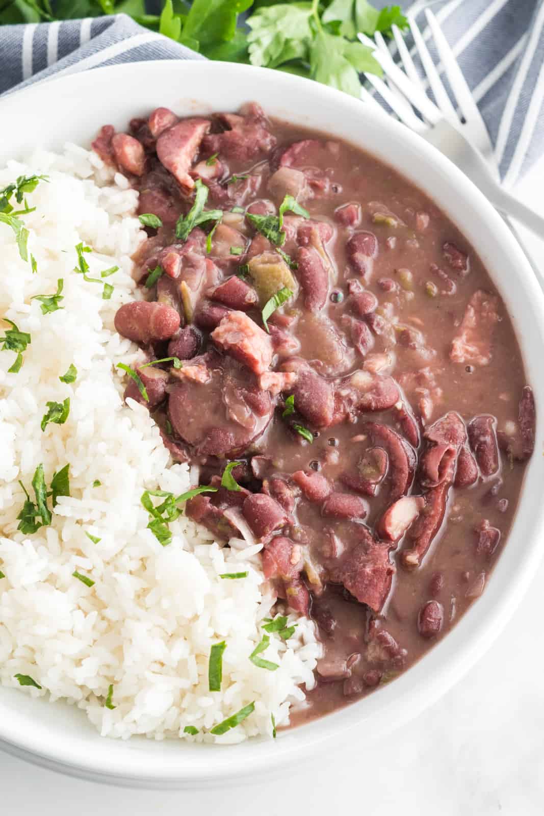 Overhead photo of red beans and rice in white bowl