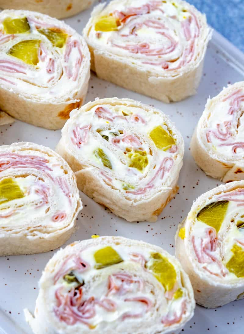 close up of pickle dip pinwheels on cutting board