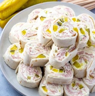 Pinwheels on white round plate stacked on top of one another