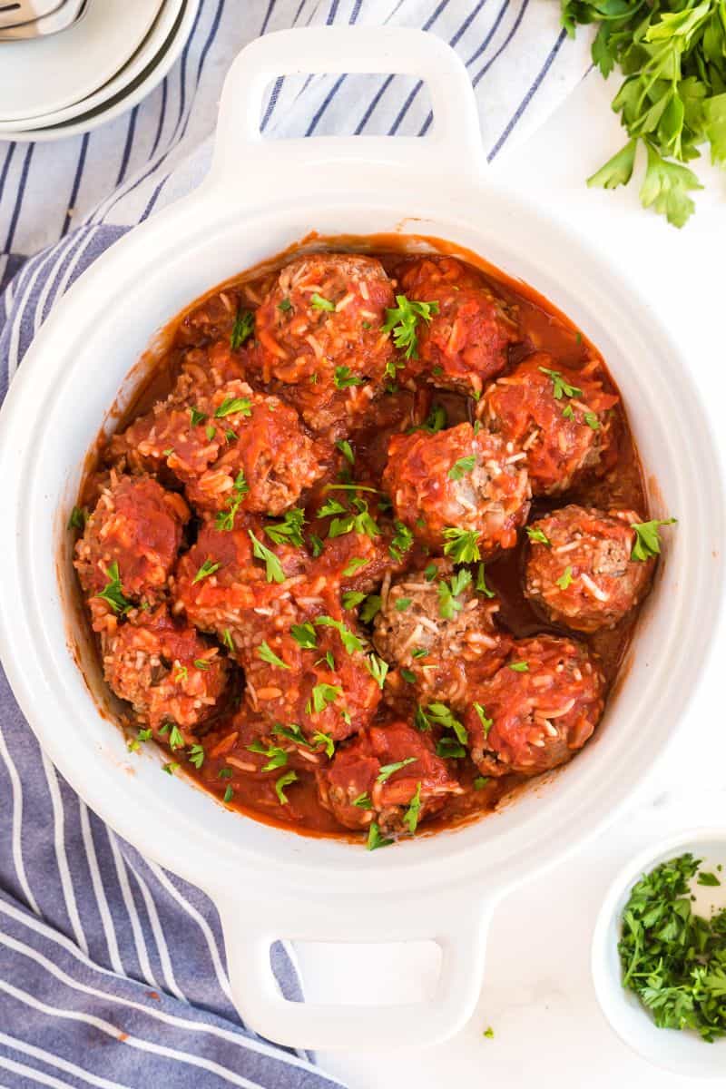 Overhead of meatballs baked in white dish