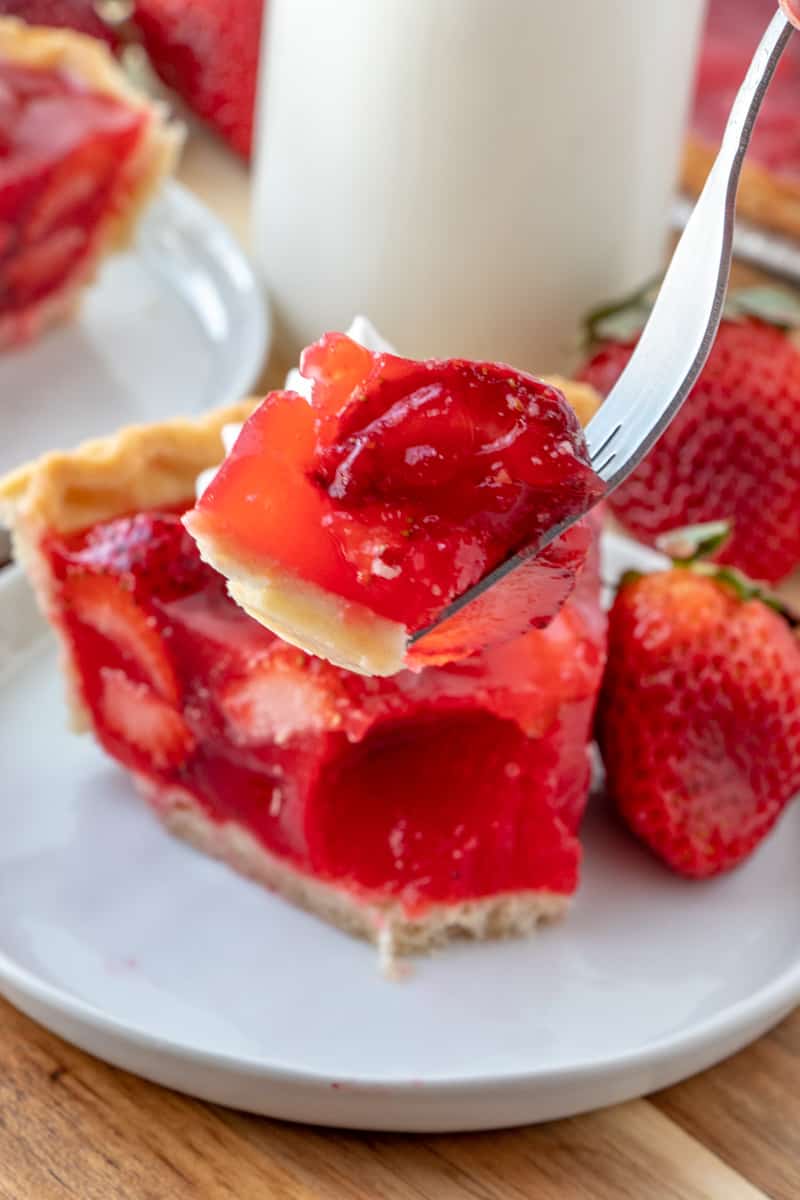 Slice of strawberry pie on fork