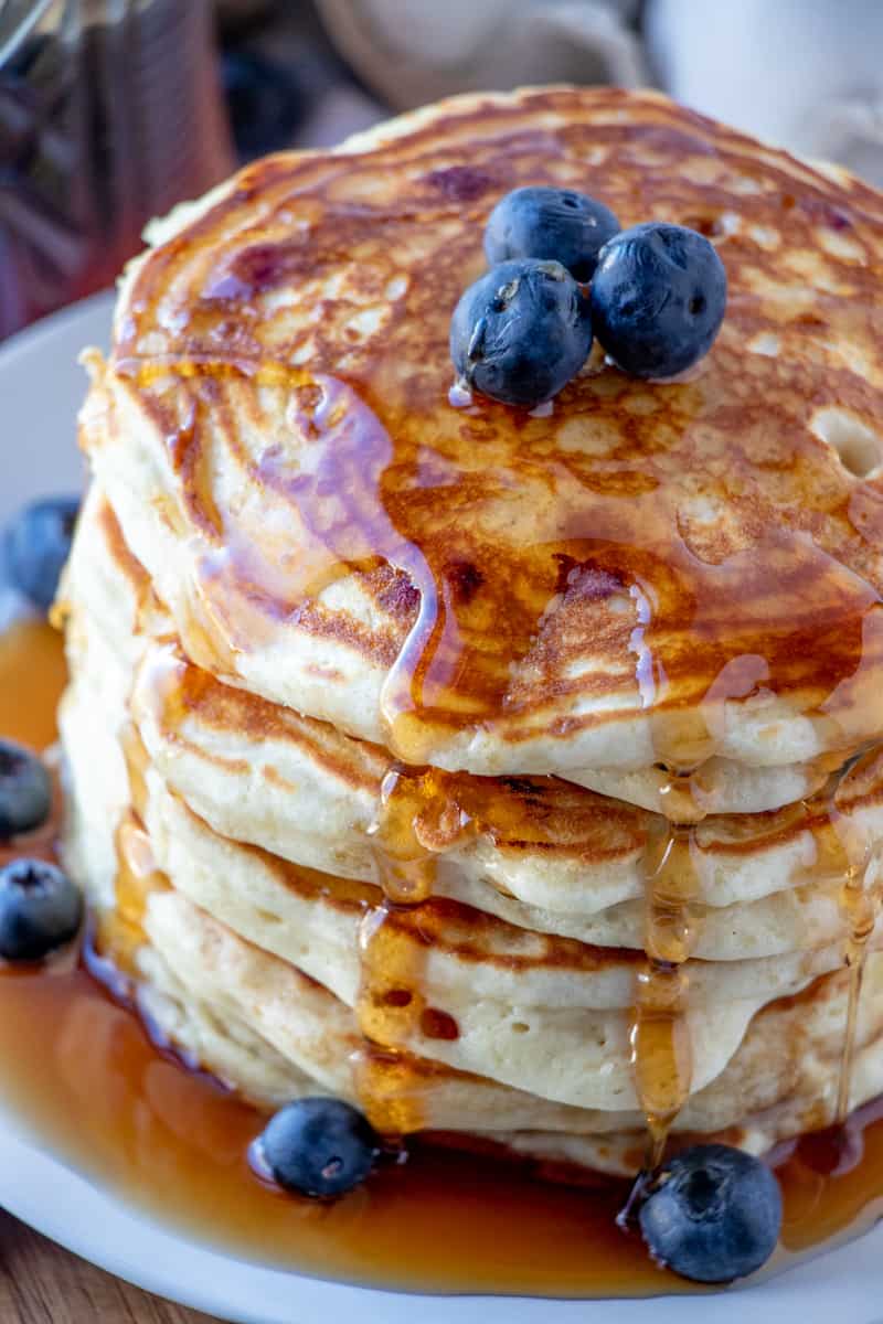 Close up overhead shot of blueberry pancakes on plate