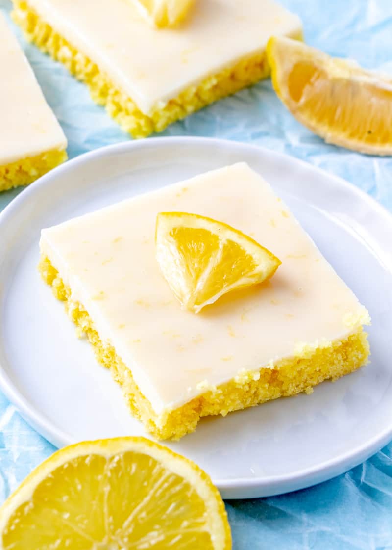 Cake Mix Lemon Squares on plate with slice of lemon on top