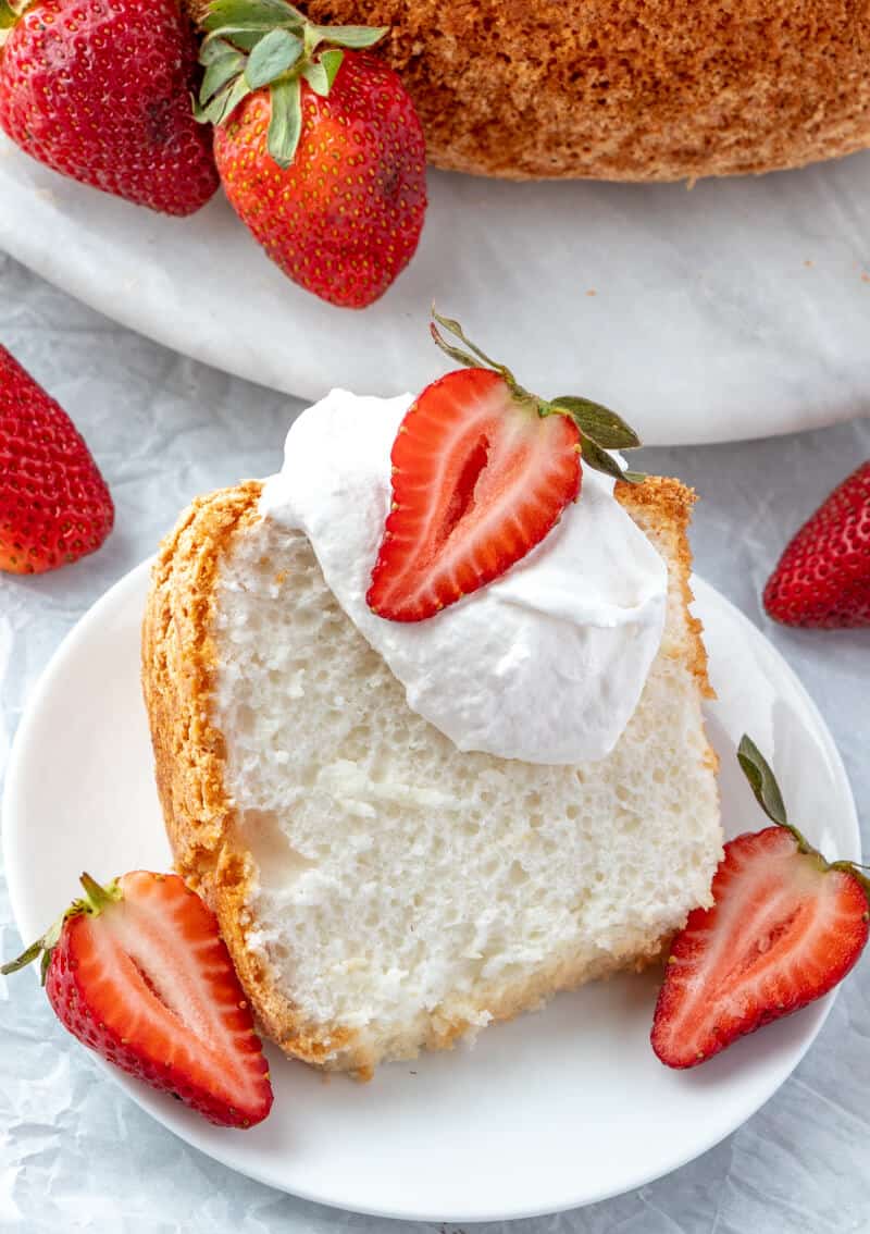 finished overhead shot of angel food cake with whipped cream and strawberries