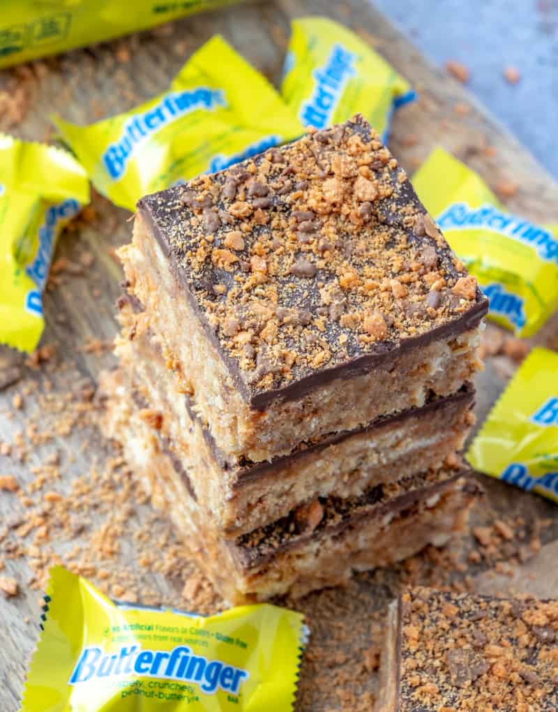 3 butterfinger squares on top of one another with butterfinger minis around it