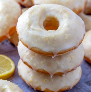 Three stacked donuts with lemon slices
