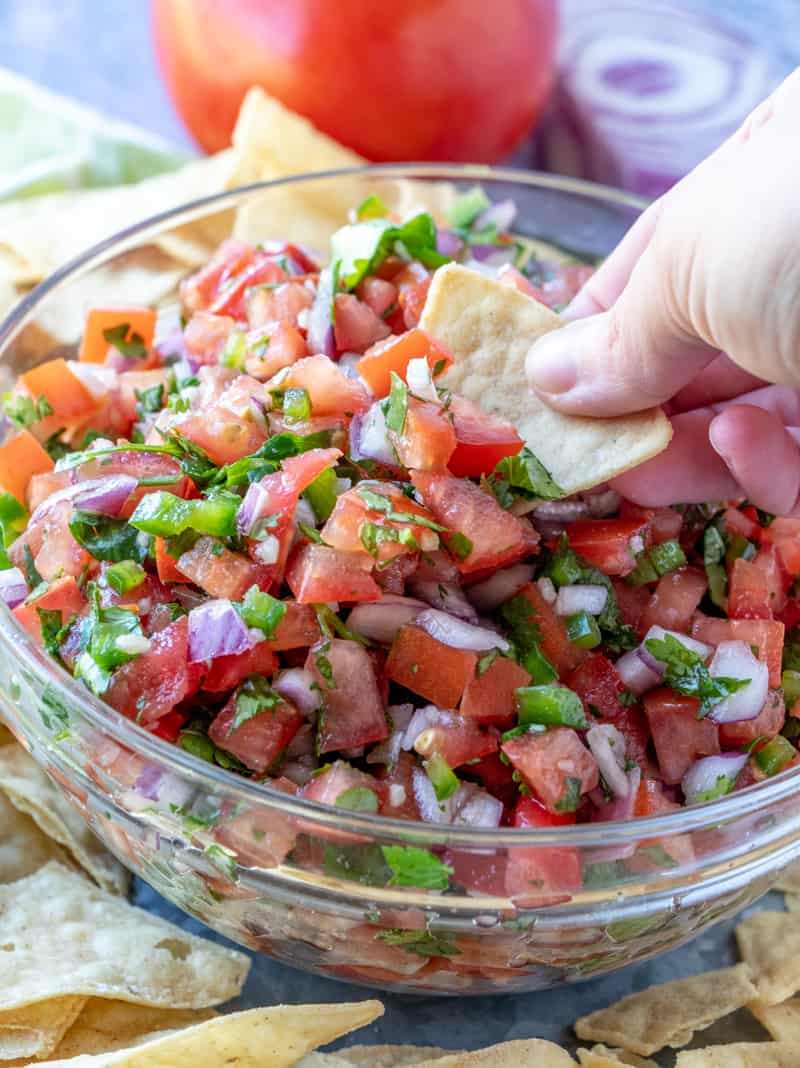 chip dipped in pico de Gallo