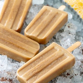Popsicles on ice garnished with coffee granules