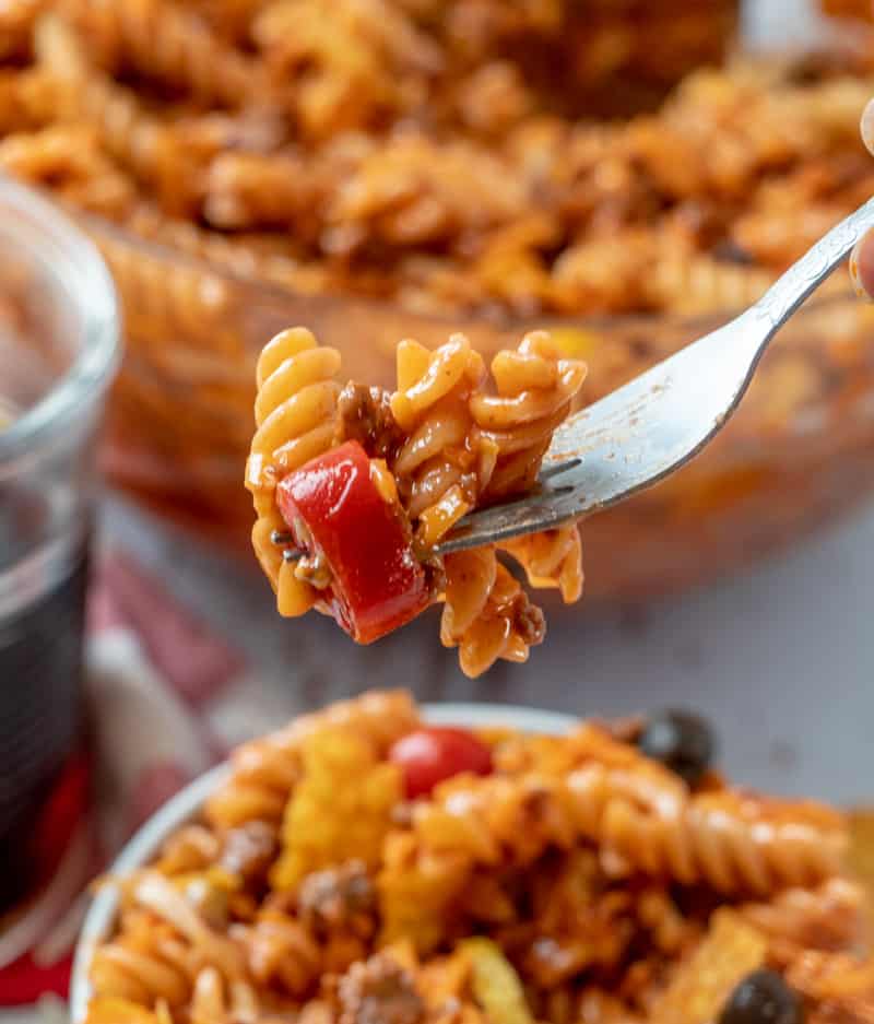 noodles and tomato on fork