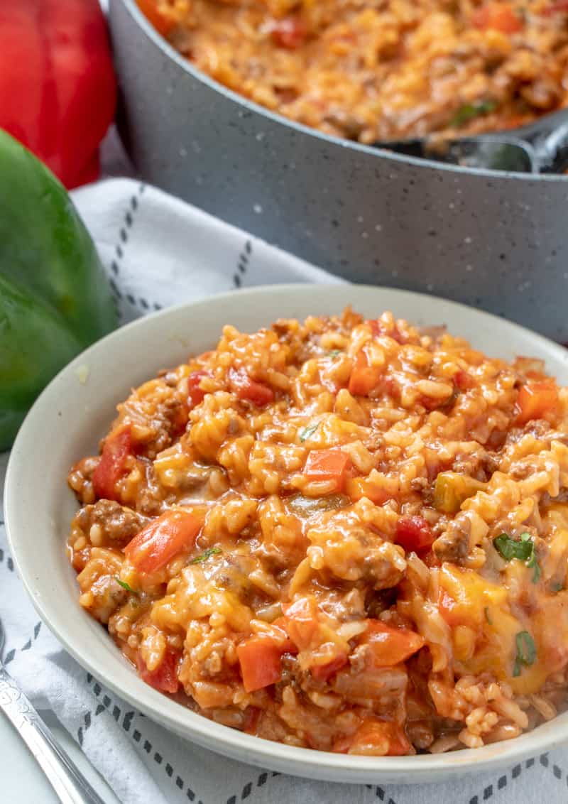 Stuffed pepper casserole plated with peppers in background