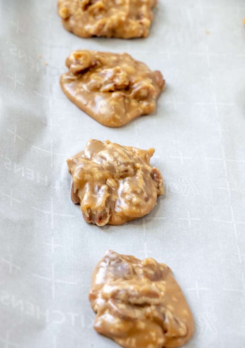 Pralines cooling on parchment paper lined baking sheets