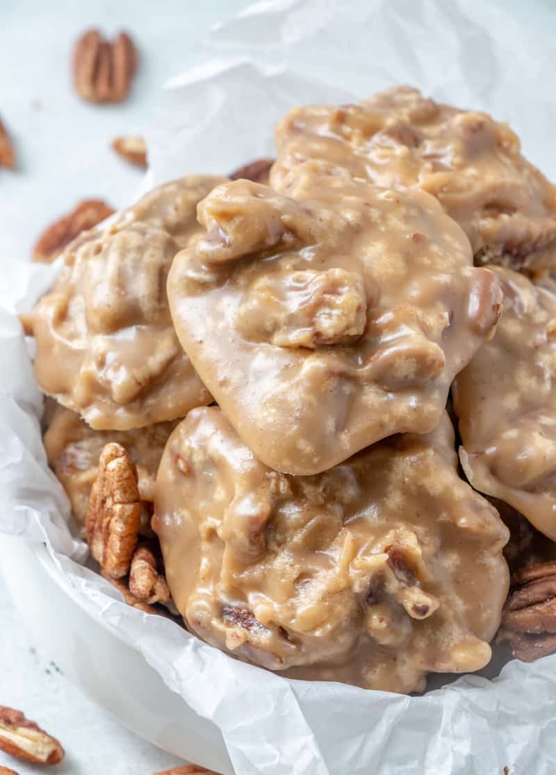 Pecan Pralines in parchment paper line bowl showing the crystallization