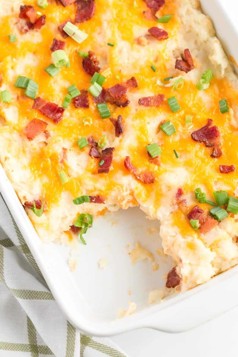 Overhead photo of mashed potato casserole with slice taken out