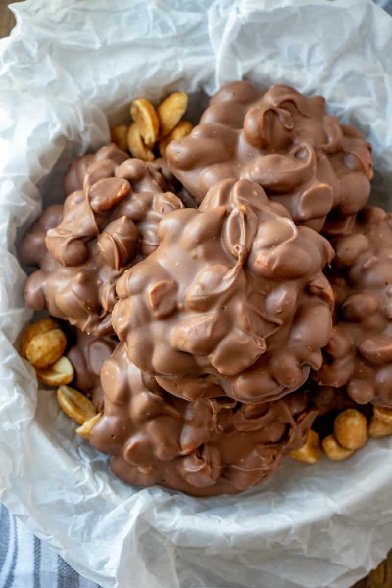Overhead photo of clusters with peanuts in bowl with hardened chocolate