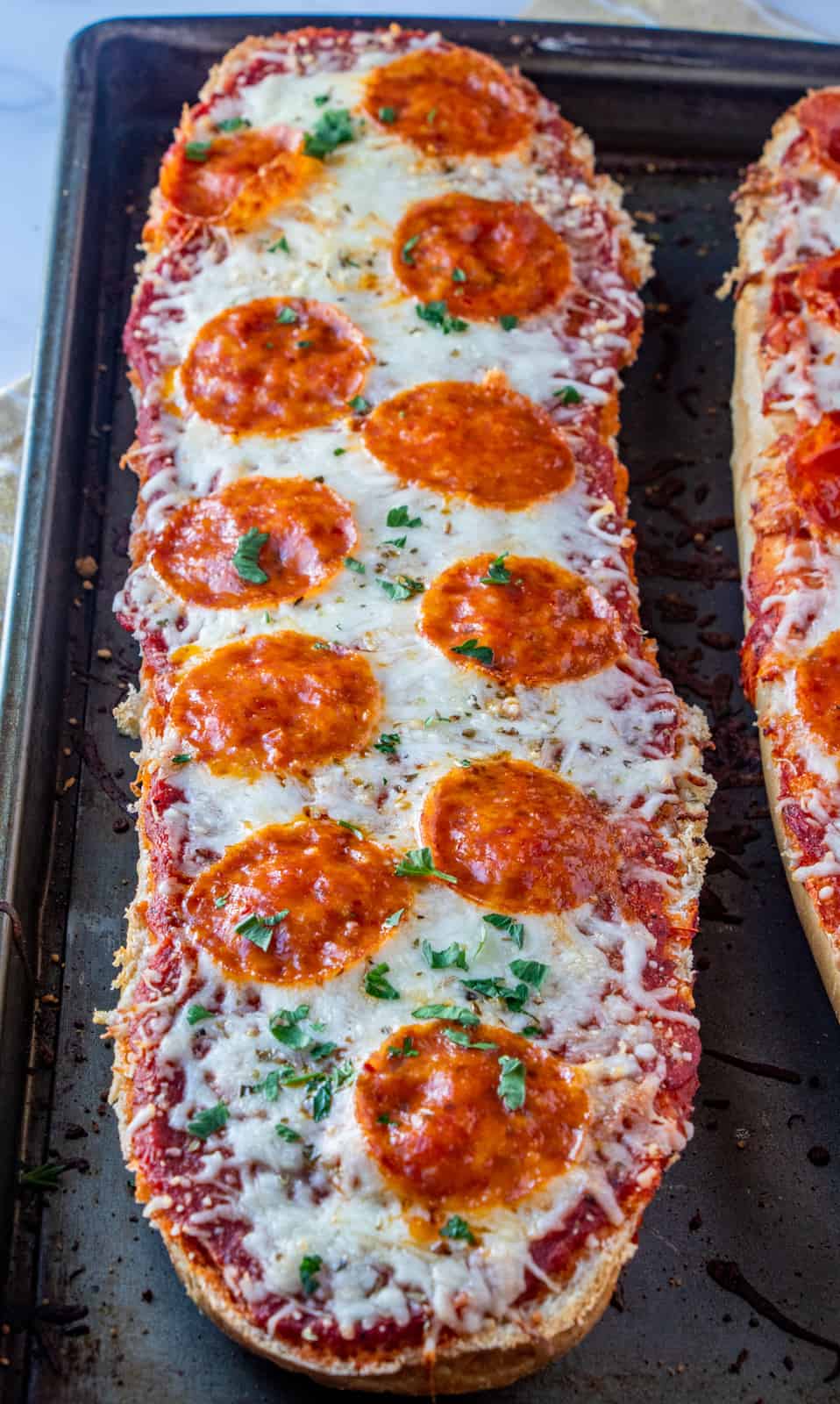 Baked pizza on baking pan right out of oven