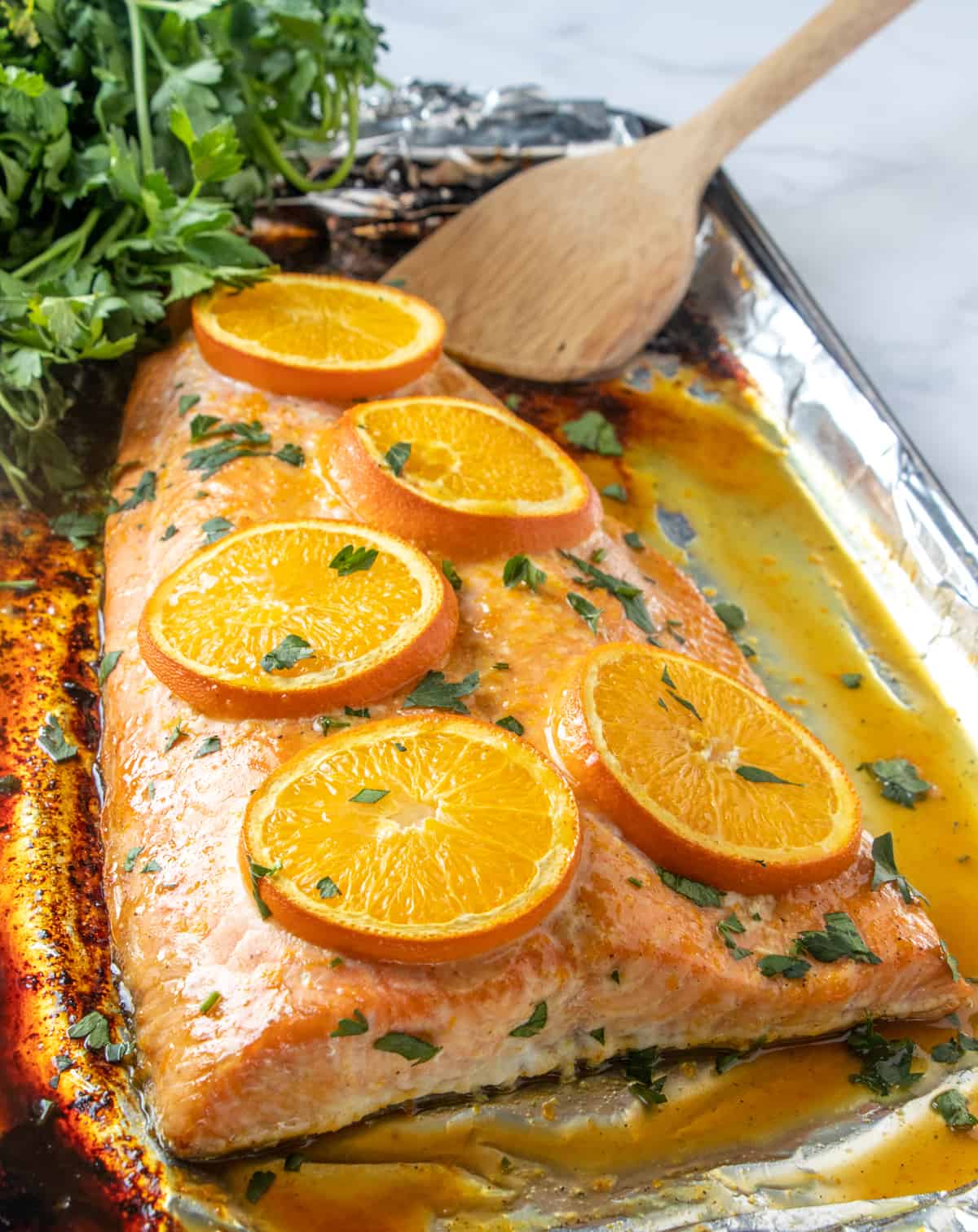 Large salmon filet baked with oranges and parsley