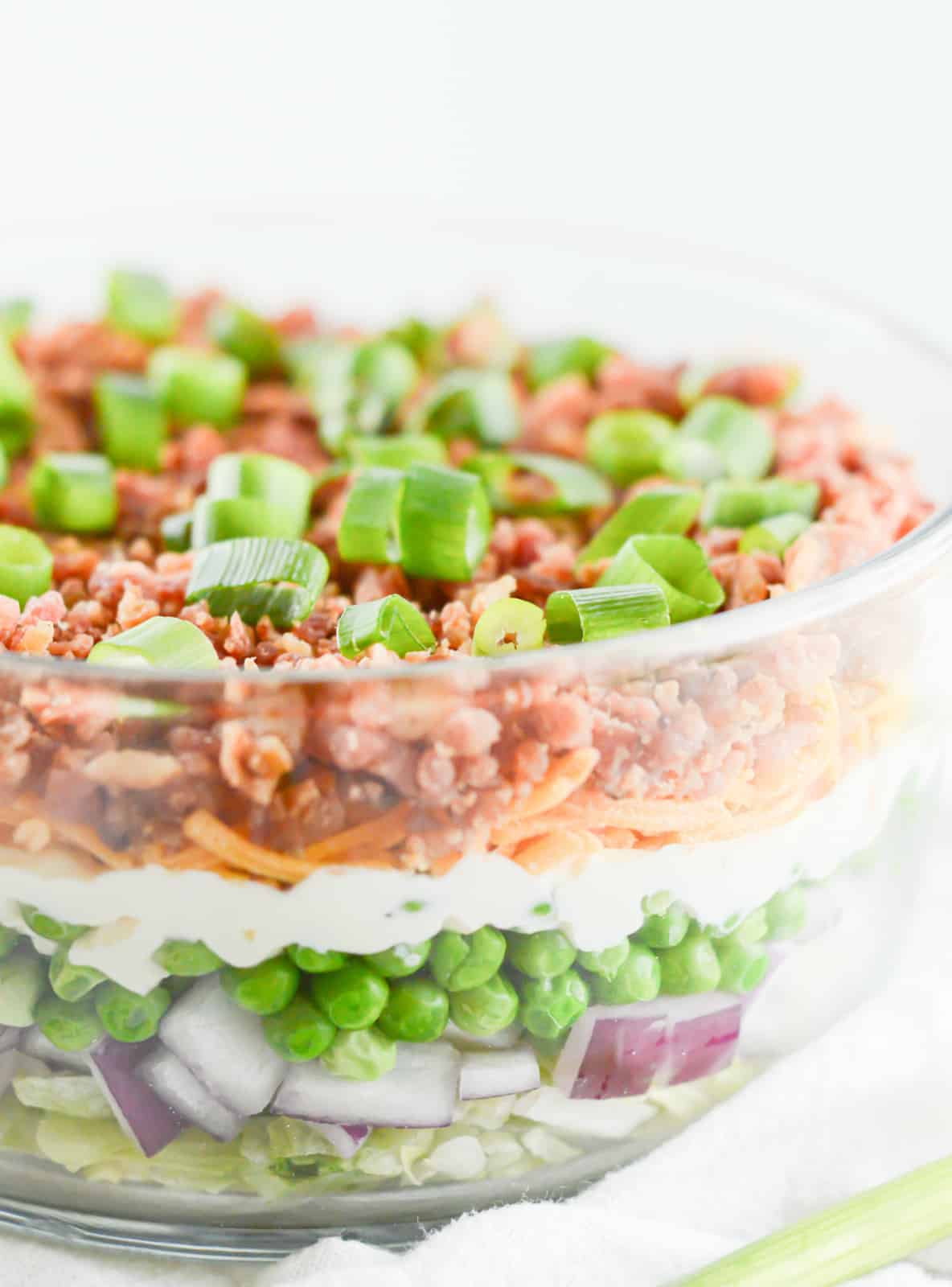 Layers of Seven Layer Salad in bowl