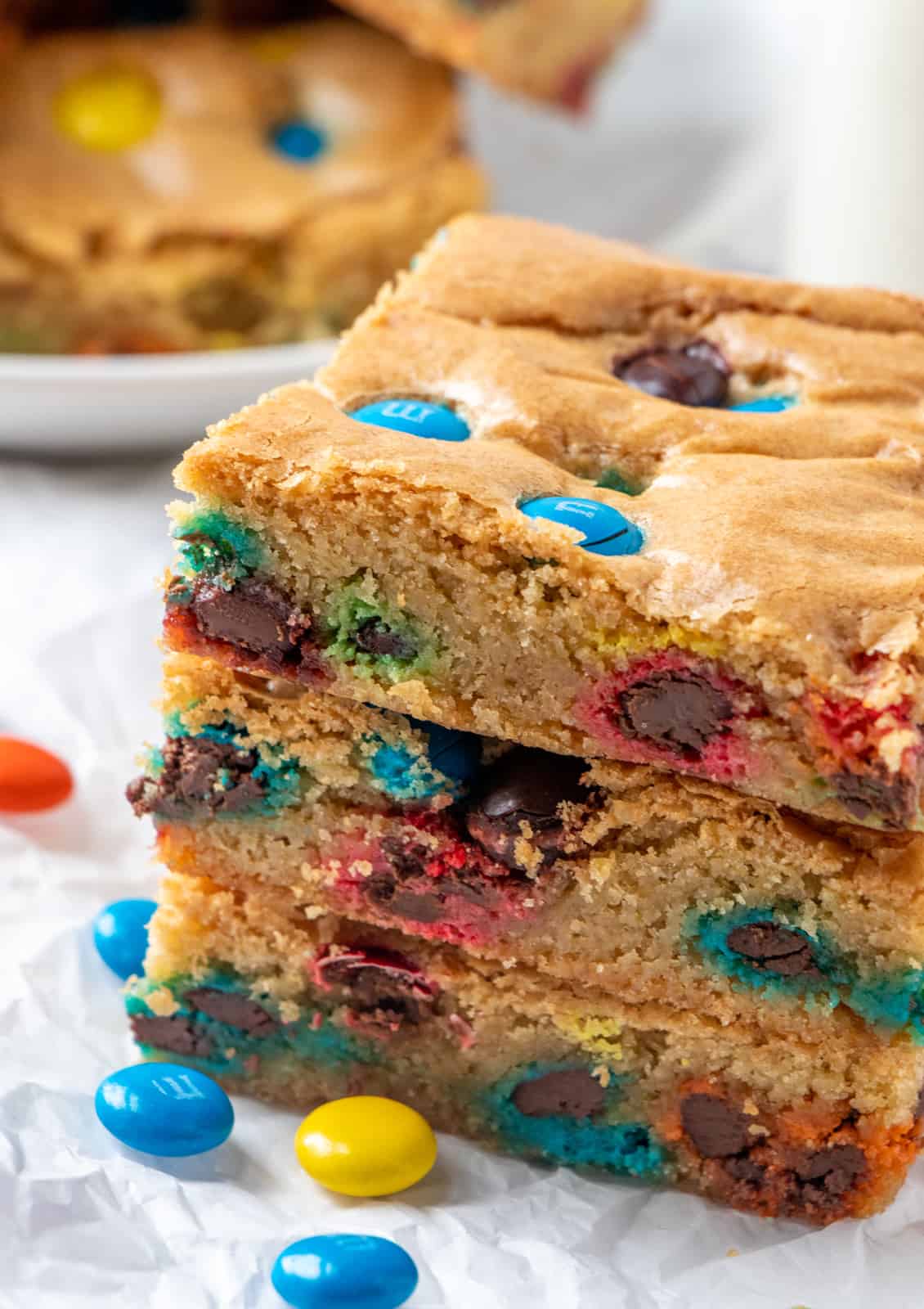 Up close of side of blondies showing the baked in candies