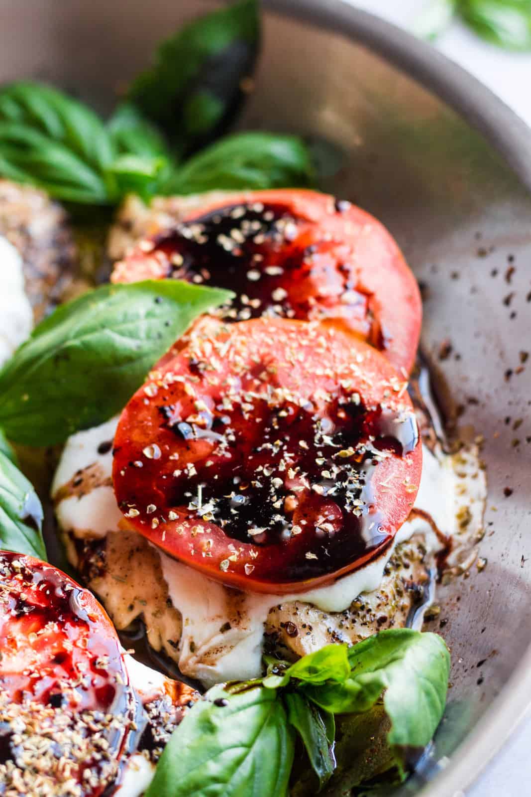 Close up of Caprese Chicken in pan