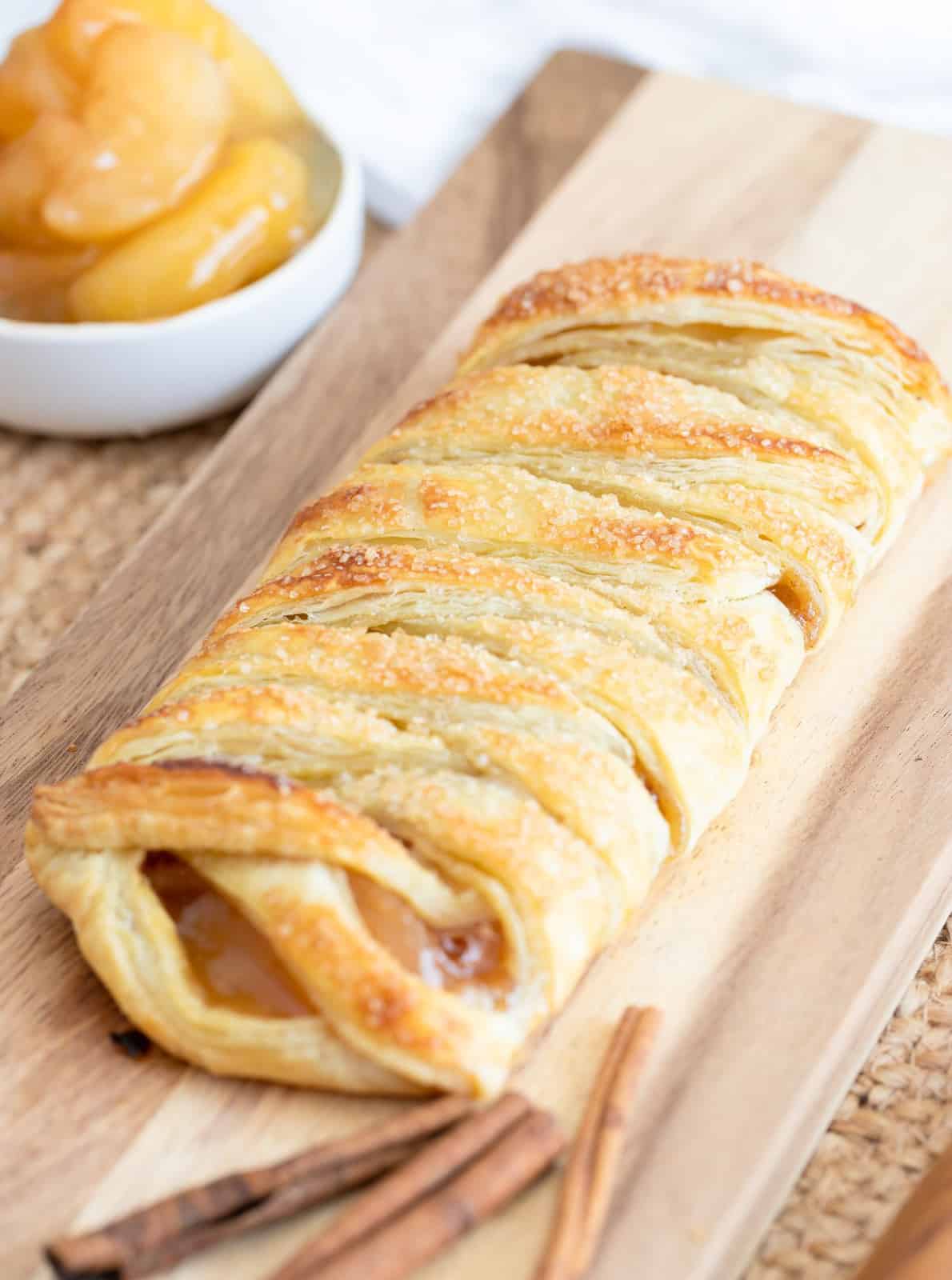 Finished Braided Apple Puff Pastry on cutting board