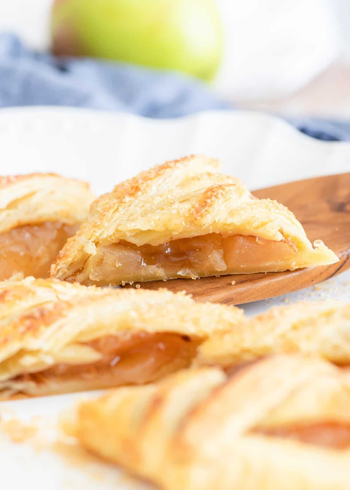 Sliced up Puff Pasty with spatula stopping one up